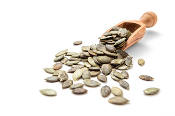 Pumpkin seeds in wooden scoop