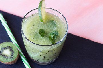 Kiwi smoothie with lime and mint.