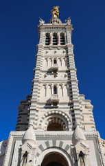 The scenic stone bell tower of Notre Dame de la Garde Basilica, Marseille, France.