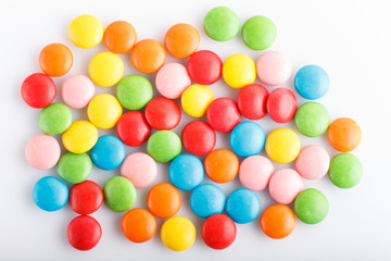 Colorful  multicolored chocolate candy dragees isolated on white background.