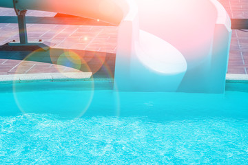 Obraz na płótnie Canvas Stylishly interesting water slide in the pool near the sea on nature background