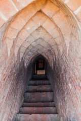 Fototapeta na wymiar Narrow steep stairway in Pyathada Paya temple in Bagan, Myanmar