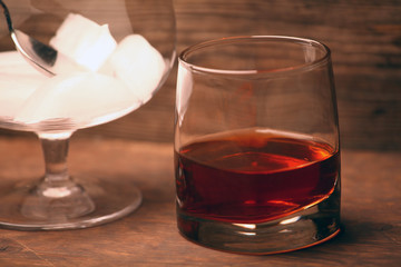 ice whiskey glass wooden background 