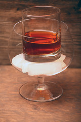 ice whiskey glass wooden background 