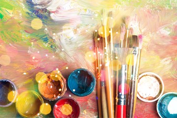 Fototapeta premium Artist paint brushes and paint cans