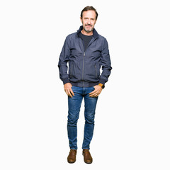 Fototapeta premium Middle age handsome man wearing a jacket Relaxed with serious expression on face. Simple and natural looking at the camera.