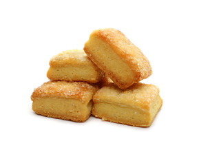 Cookies are a lot of square pile of cottage cheese isolated on white background.