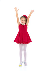 Joyful girl with arms raised.