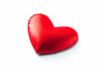 Red pillow in the form of heart isolated on white background. 3d rendering.