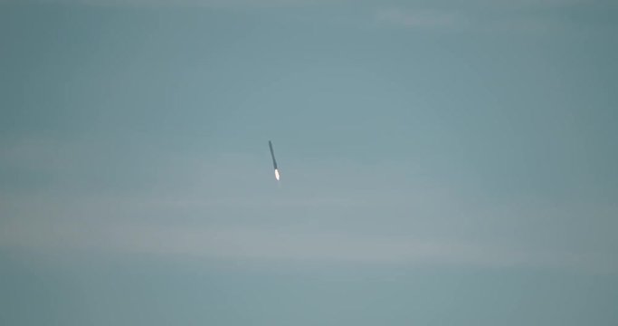 First-stage booster descends back to landing zone at Cape Canaveral after launching a space capsule to the International Space Station. 4K at 120 fps slow motion.