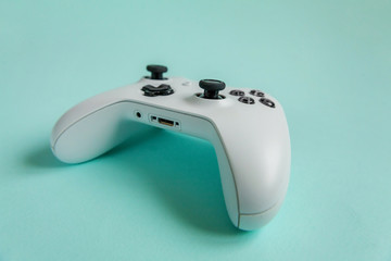 White joystick gamepad, game console on blue colourful trendy modern fashion pin-up background. Computer gaming competition videogame control confrontation concept. Cyberspace symbol © Юлия Завалишина