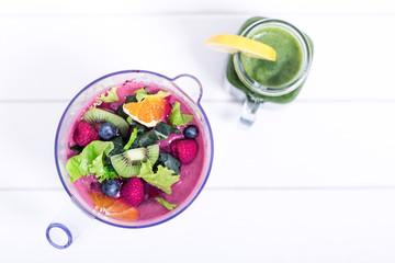 Making smoothie with berries and fruits