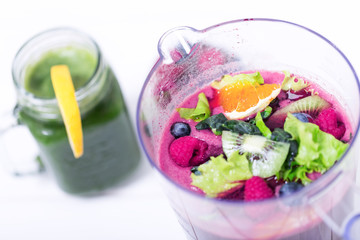  Kiwi, raspberry and orange slices blended for tasty breakfast