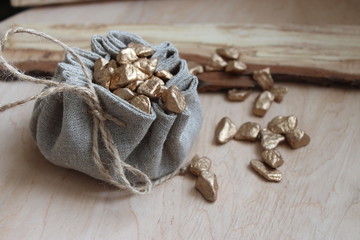 Cotton bag full of gold symbolizing richness and prosperity