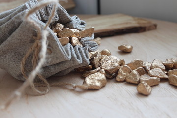 Cotton bag full of gold symbolizing richness and prosperity