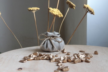 Cotton bag full of gold symbolizing richness and prosperity