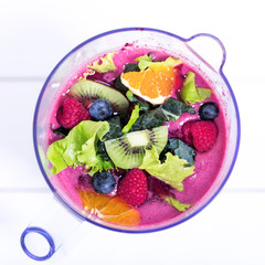 Obraz na płótnie Canvas Fruits and berries in blender, macro