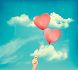 Fototapeta na wymiar Valentine heart-shaped baloons in a blue sky with clouds. Vector retro background