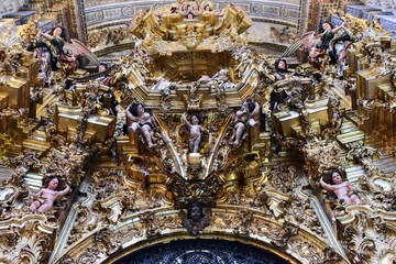 Details from the interiors of the baroque church of Salvador in Seville, Spain