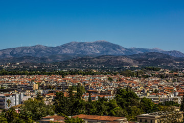 Fototapeta na wymiar aerial European city photography in valley with mountain background scenery landmark 