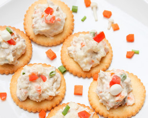 Tasty crackers with cream cheese,carrot.Healthy snacks, on dish