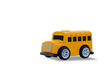 small yellow metal toy school bus clipping path on white background