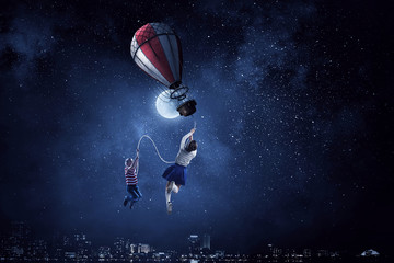 Naklejka premium Girl fly in sky. Mixed media
