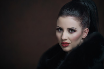 Fototapeta premium Girl with a black fur