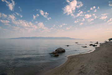 Morning at the Barguzinsky Bay of Lake Baikal. Peninsula Holy Nose.