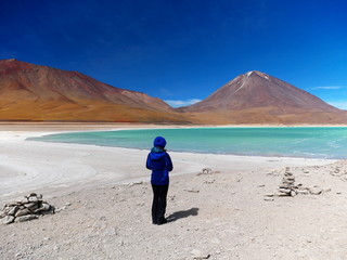 Young woman at Laguna verde and Vulcan Licancabur