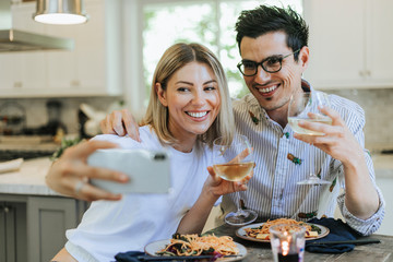 Couple taking a selfie during their dinner