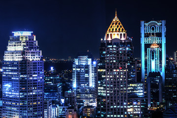 landscape scenery of buildings and skycrapers in the central business area of Bangkok city at night