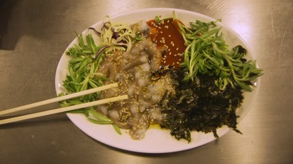 Chopped Live Squid Dish Moving at Gwangjang Market in Seoul, South Korea