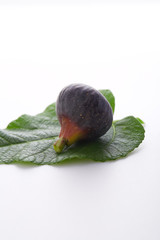 Fresh fig and Leaves on white