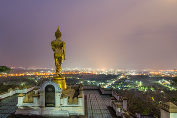 Buddha statue standing on a mountain at Wat Phra That Khao Noi, Nan, Thailand