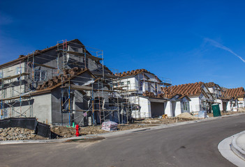 Fototapeta na wymiar Scaffolding On New Two Story Home Construction
