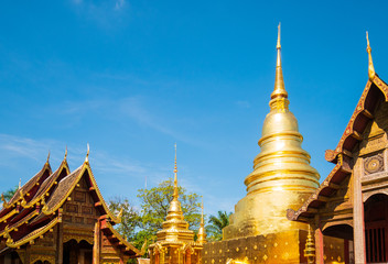 Naklejka premium Wat Phra Singh landmark in Chiang Mai is a Lanna style temple. It is the main temple of Chiang Mai and is a popular tourist attraction for tourists visiting in travel concept.