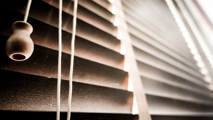 evening sun light outside with wooden window blinds, sunshine and shadow on window blind,...