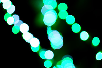 out of focus colour light in the dark night.