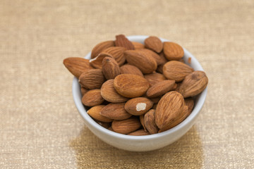Dried almons in porcelain bowl