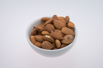 Dried almons in porcelain bowl
