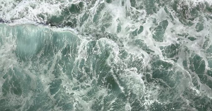 Gorgeous blue ocean water with white caps as seen from above in 4k