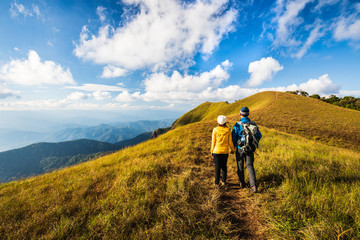 Fototapeta premium Lover backpacking hiking on mountains. Doi Mon Chong, Chiangmai, Thailand.