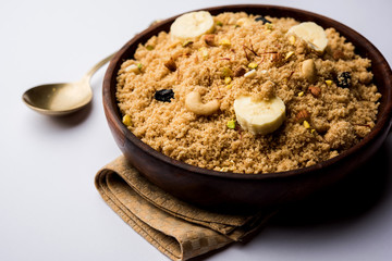 Semolina Halwa / Sooji ka Halva or sweet Rava Sheera or shira - Indian festival sweet made of semolina, nuts and Ghee