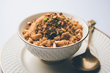 Semolina Halwa / Sooji ka Halva or sweet Rava Sheera or shira - Indian festival sweet made of semolina, nuts and Ghee