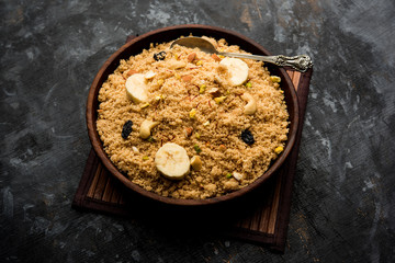 Semolina Halwa / Sooji ka Halva or sweet Rava Sheera or shira - Indian festival sweet made of semolina, nuts and Ghee