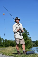 Older Senior Sportsman And Happiness With Rod And Reel Fishing