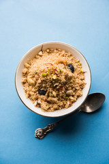 Semolina Halwa / Sooji ka Halva or sweet Rava Sheera or shira - Indian festival sweet made of semolina, nuts and Ghee