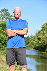 Male Senior And Muscles Outdoors