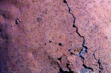 Background photo of old rusty metal bucket with breaking surface, grunge texture background.